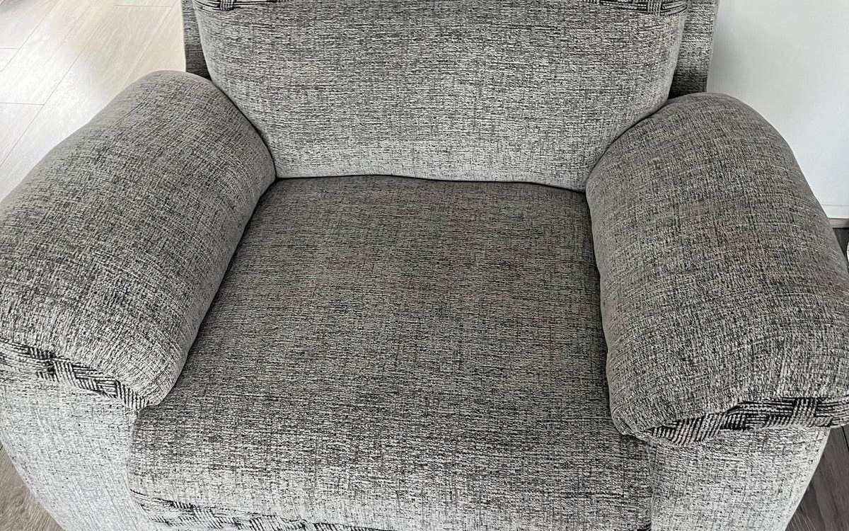 A grey armchair after deep cleaning by Jay's Cleaning