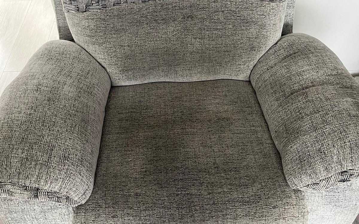 The same armchair before cleaning, grubby seat