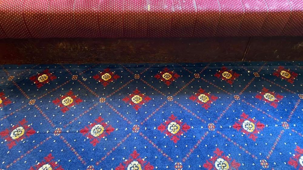 The club's banquette seating and carpet after cleaning, colours vivid again
