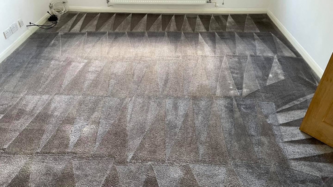 The grey carpet after cleaning — fresh and clean