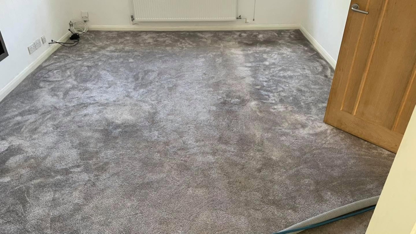 A grey carpet before cleaning by Jay's Cleaning