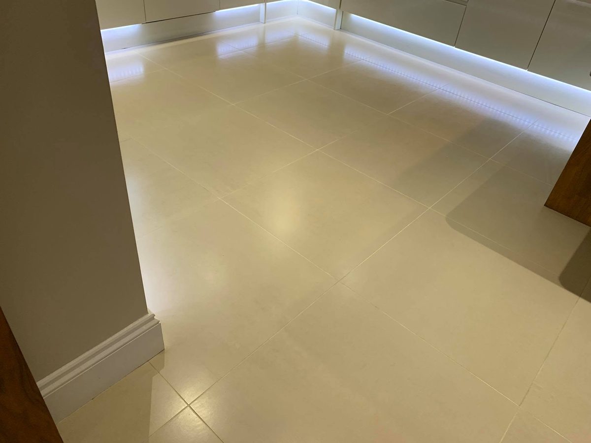 The same kitchen floor after, grout white again