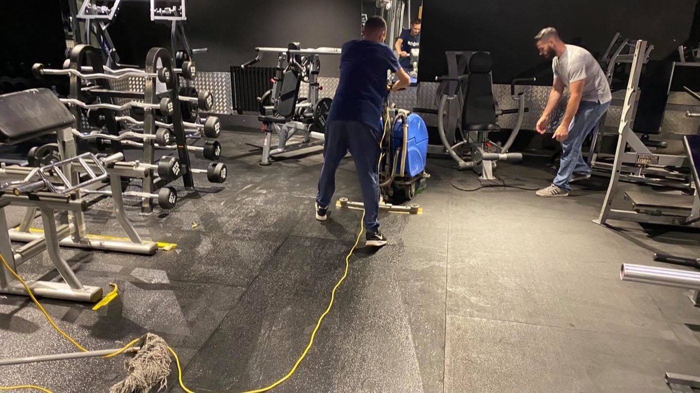 Jay's Cleaning cleaning a gym sports-hall floor