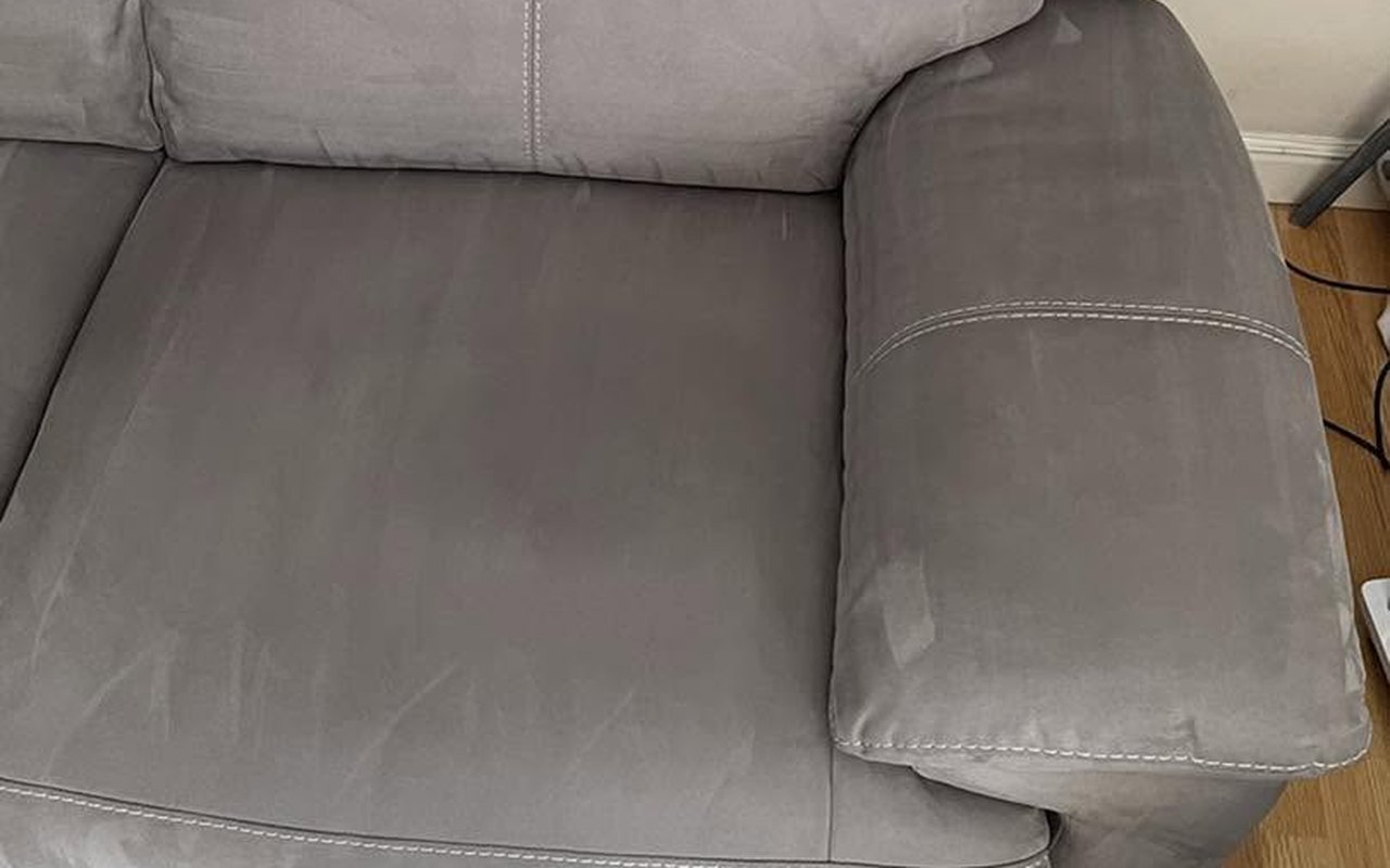 The same grey sofa after cleaning, rings and grime gone