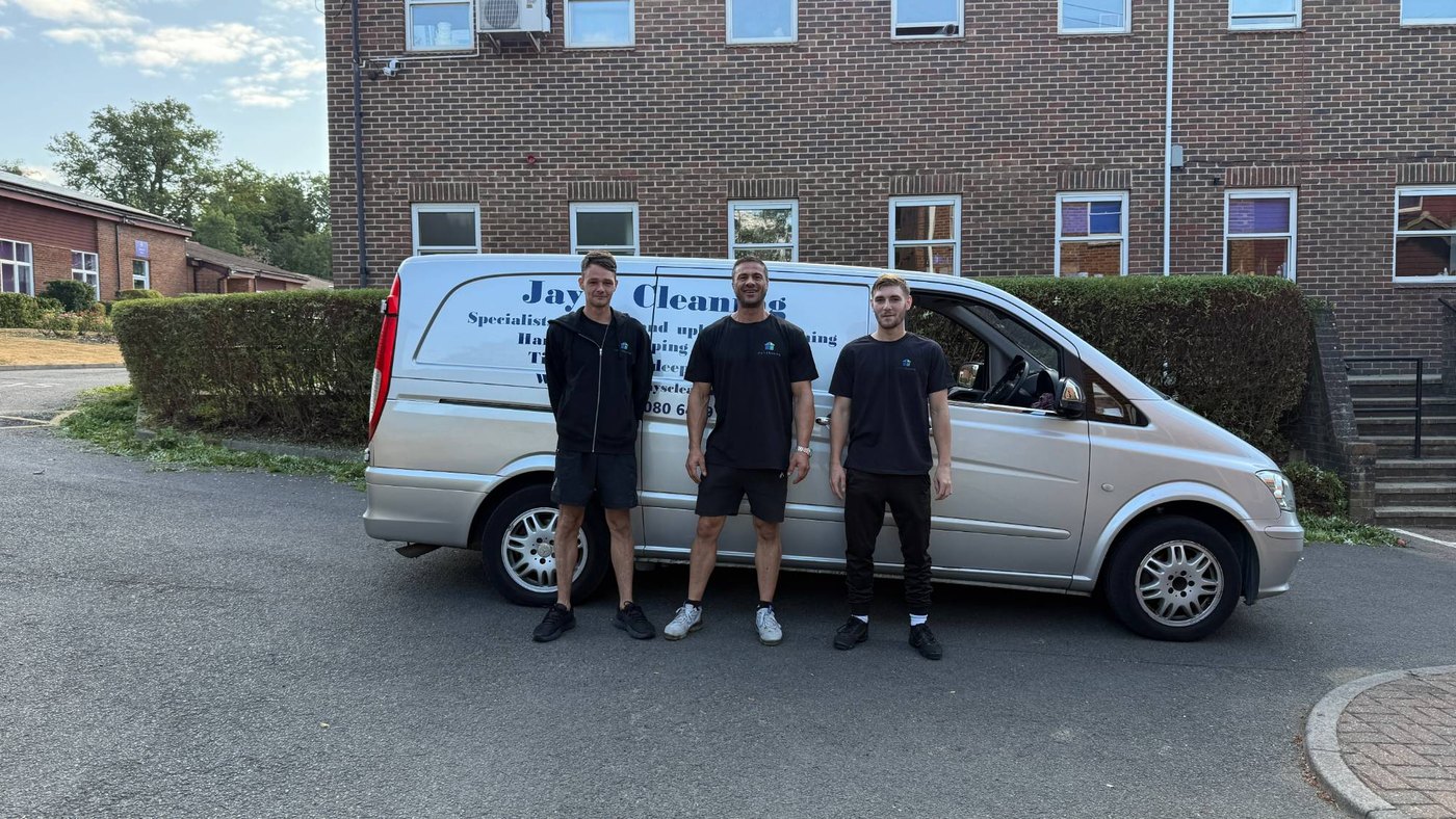 The Jay's Cleaning team of three with the van outside a school in Watford