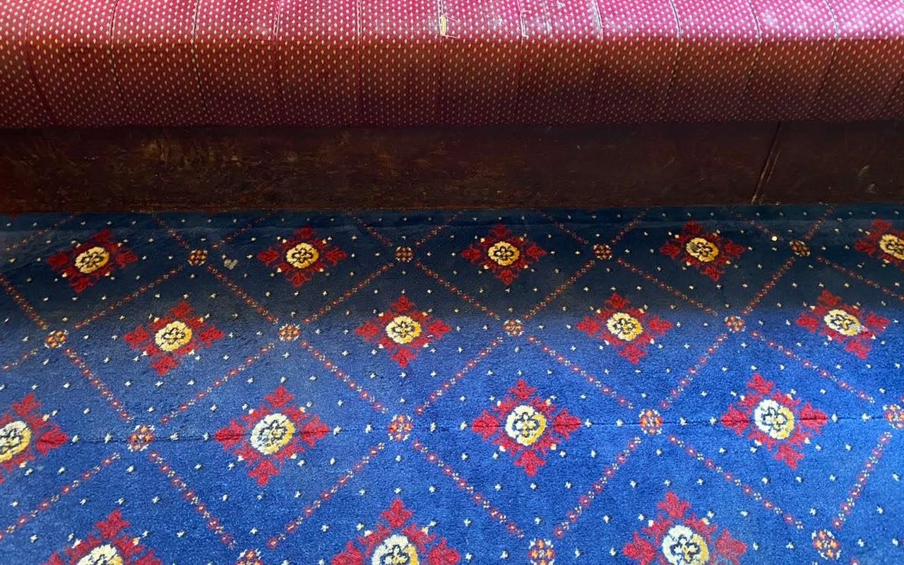 The same function-room carpet after cleaning. Stain gone and colours revived