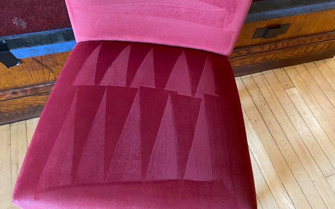 The same velvet chair after cleaning. Stains gone and pile groomed